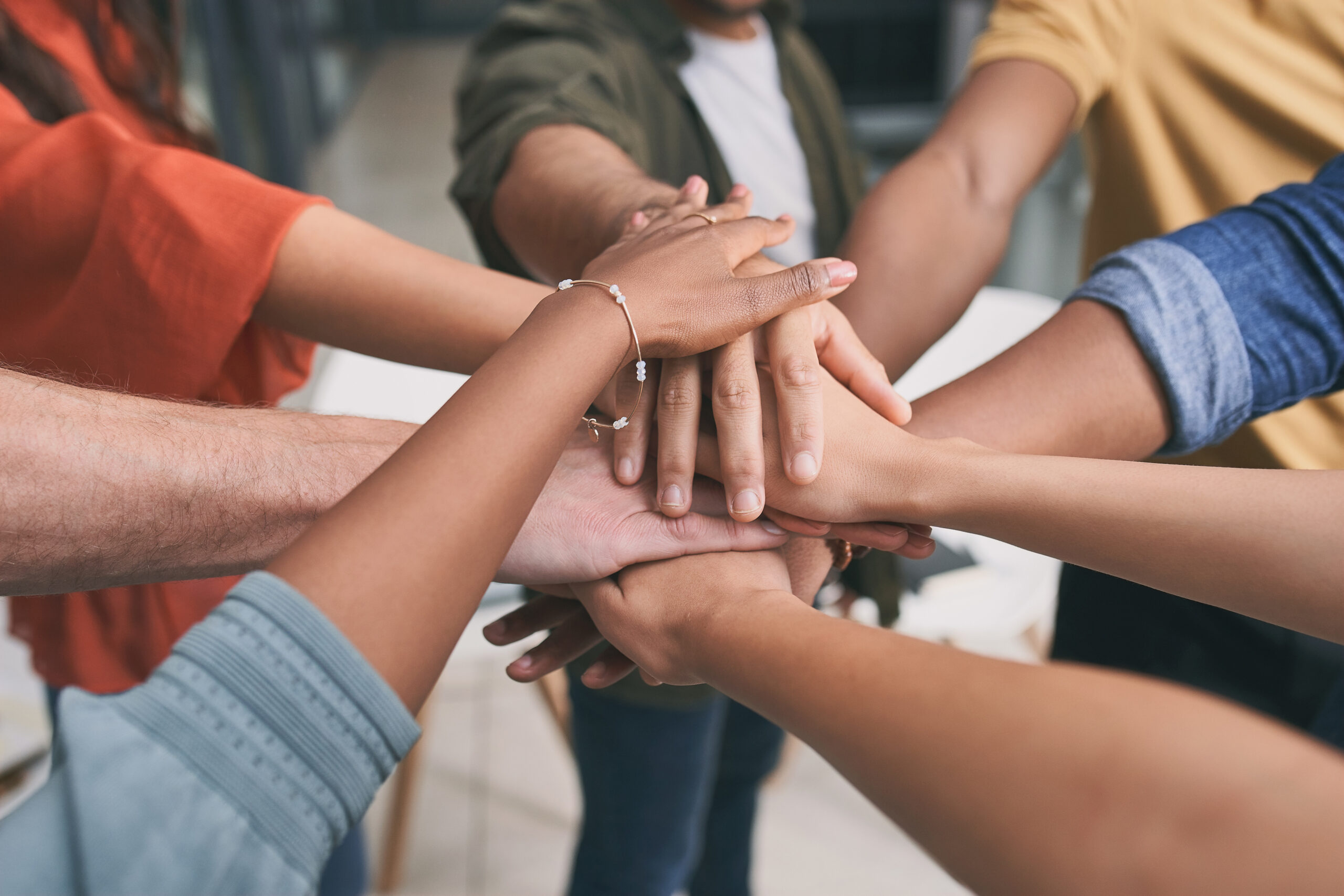 Hard work beats talent if talent doesnt work hard. a unrecognizable team of business people stacking their hands in motivation. get_involved_img_01_helpful_hearts